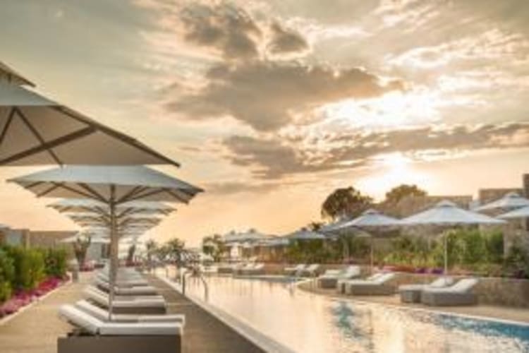 Swimming pool and sun loungers
